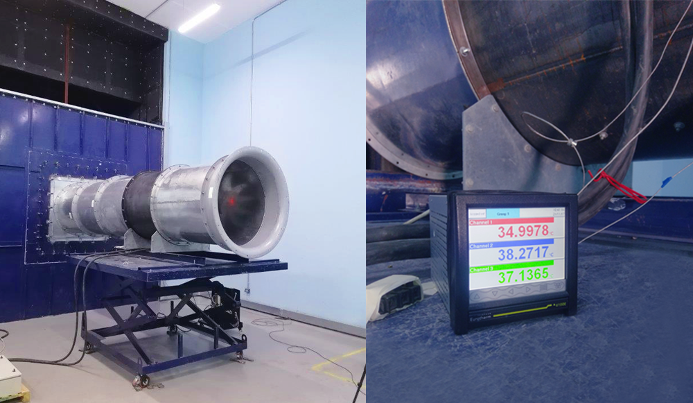 Industrial exhaust fan unit mounted on testing platform in AMCA-accredited laboratory facility for certification and performance validation